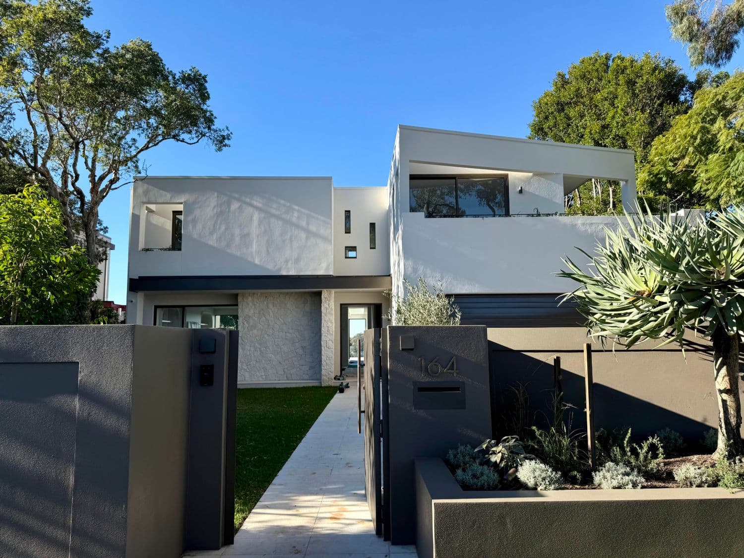 Finished front garden and stone entry path at a modern Castlecrag home